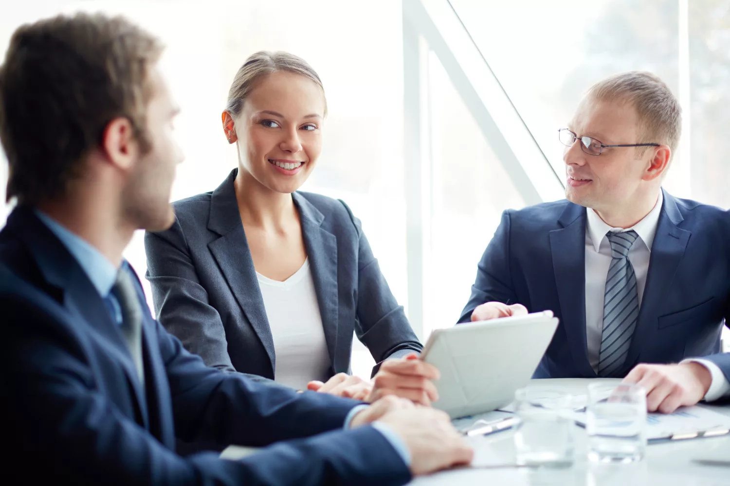 Business professionals discussing Directors & Officers (D&O) Insurance at a meeting table.