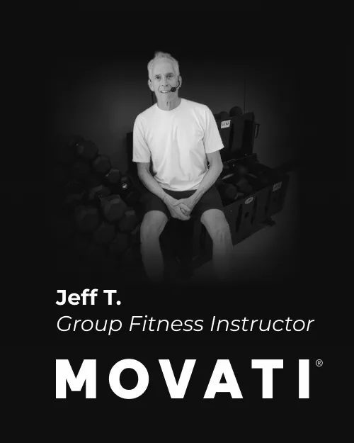 Celebrating dedication milestones, a MOVATI Guelph & Brantford instructor, Jeff T. sits by weights at the anniversary event.