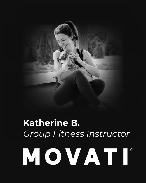 Group fitness instructor Katherine B. with a baby goat, celebrating dedication milestones at MOVATI Guelph Brantford anniversary.