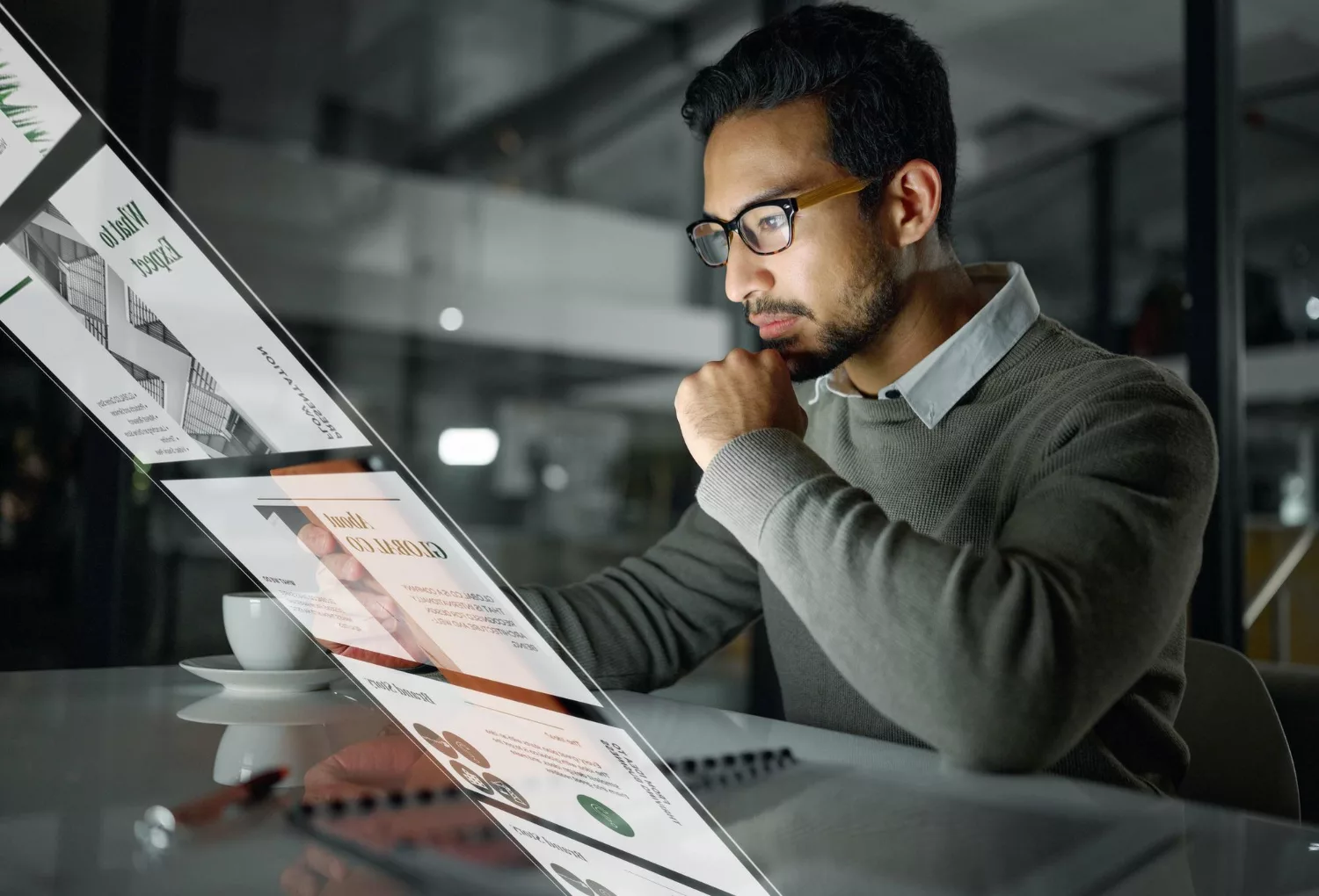 Man reviewing website analytics and SEO reports on a digital screen while using a free website audit template for AI-era SEO in 2026.