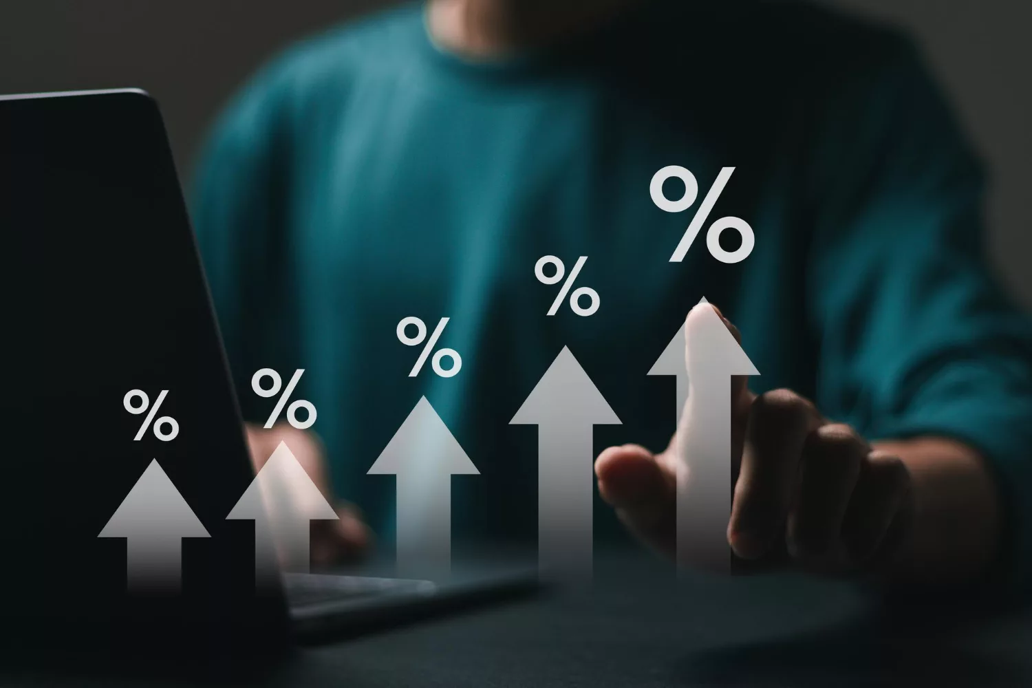 Person using a laptop with rising percentage arrows on screen, representing increasing Google Ads click-through rate and campaign performance growth.